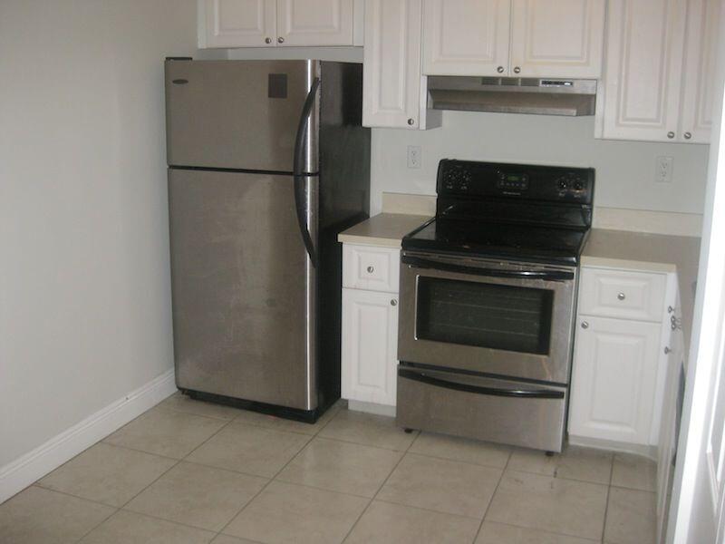 721 North Pine Island Road, Unit 116 Plantation, FL 33324 - Photo 1 of 23 a kitchen with a refrigerator and a stove