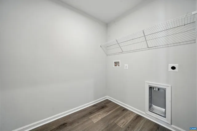 a view of a small space with wooden floor