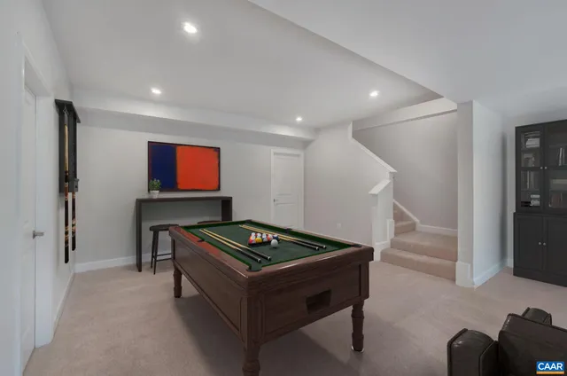 a room with furniture and air hockey table