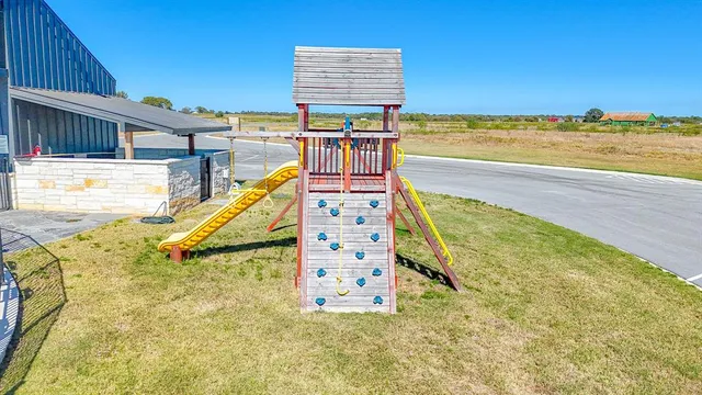 a view of a swimming pool with an outdoor space and seating area