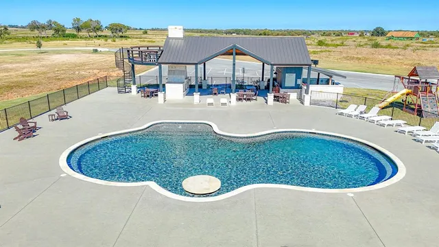 a view of a swimming pool with an ocean view