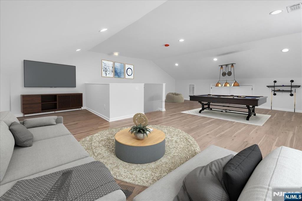 77 B Chestnut Street Lodi, NJ 07644 - Photo 25 of 36 a living room with furniture and a couch