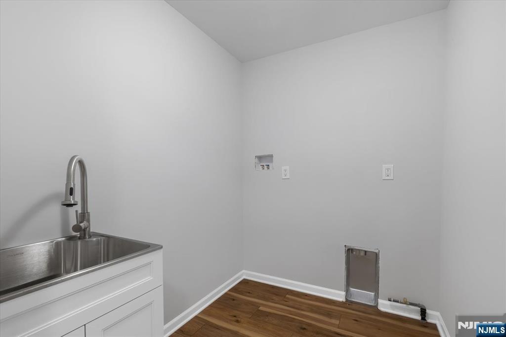 77 B Chestnut Street Lodi, NJ 07644 - Photo 29 of 36 a view of a room with a sink and wooden floor