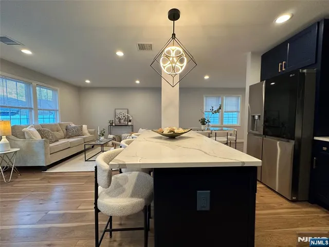 a large kitchen with a table and chairs