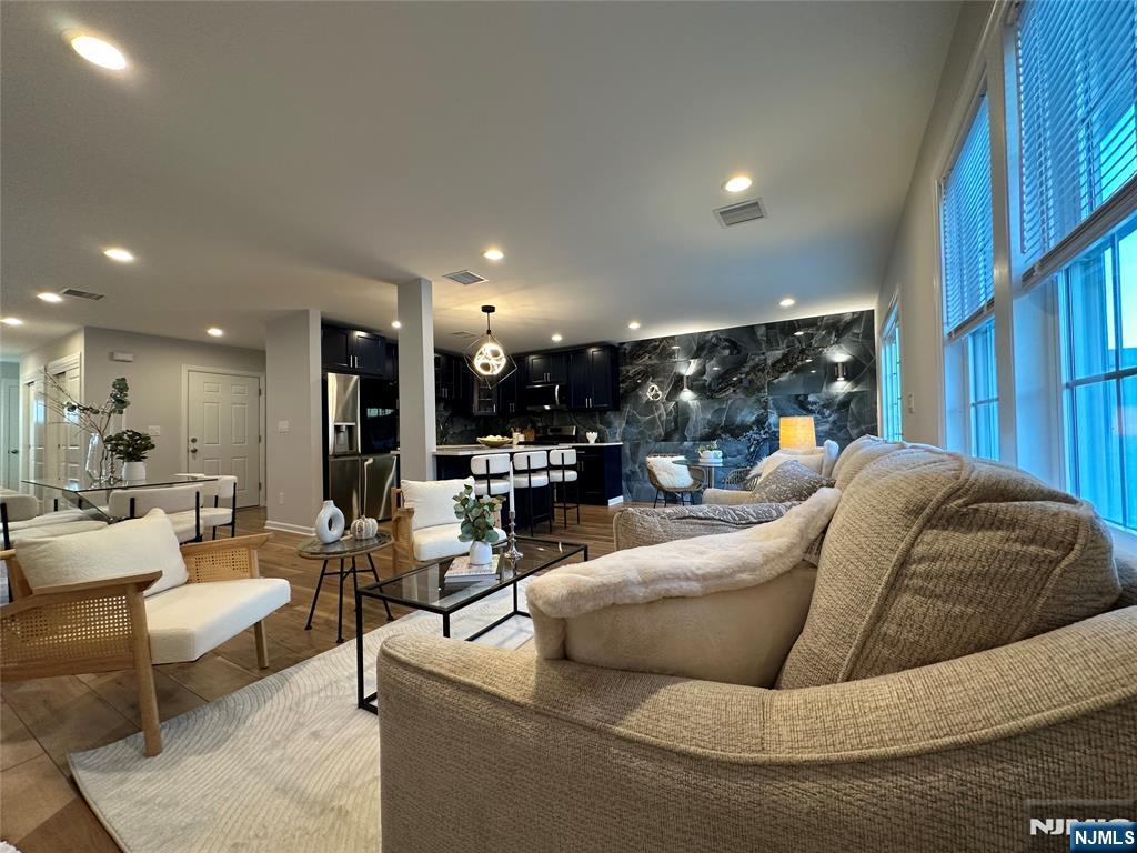 77 B Chestnut Street Lodi, NJ 07644 - Photo 6 of 36 a living room with furniture and a large window