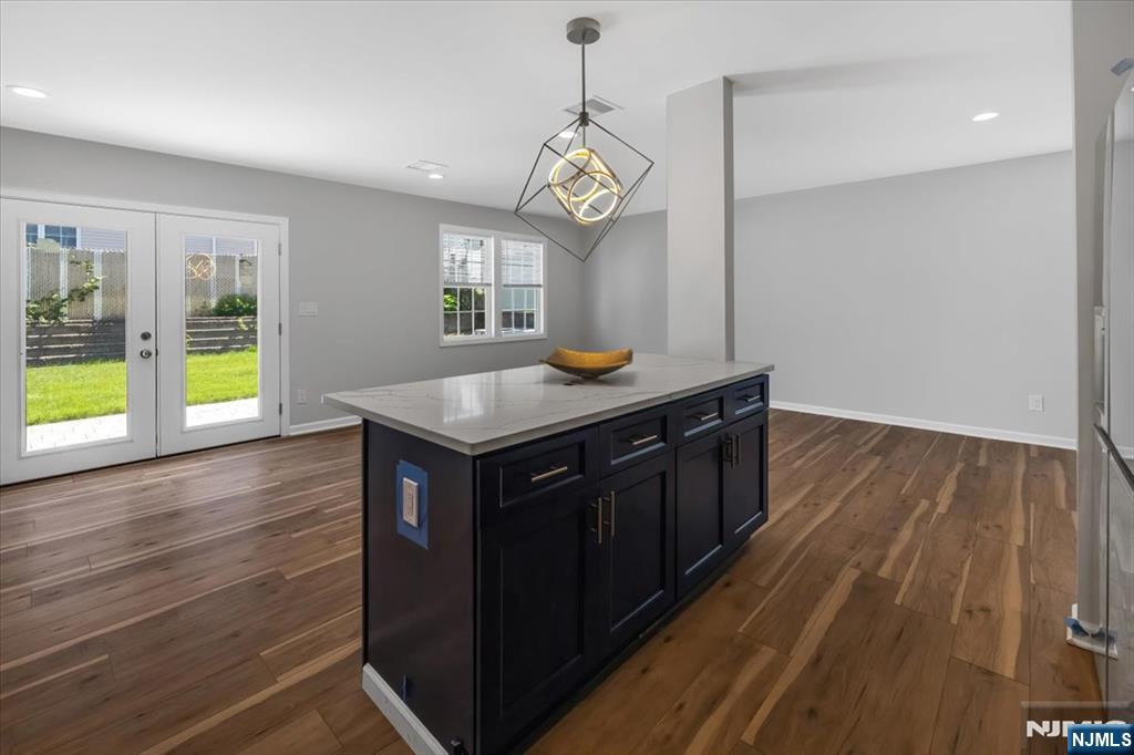 77 B Chestnut Street Lodi, NJ 07644 - Photo 10 of 36 a kitchen with a wooden floor and window
