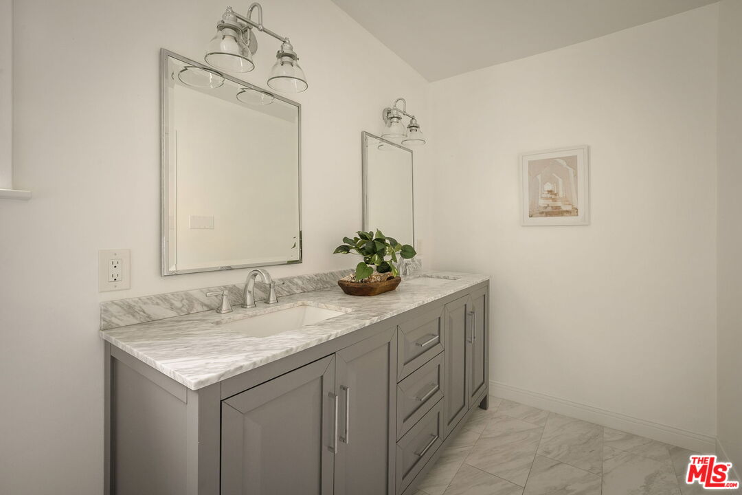 1209 Appleton Way Venice, CA 90291 - Photo 29 of 46 a bathroom with a sink and a mirror