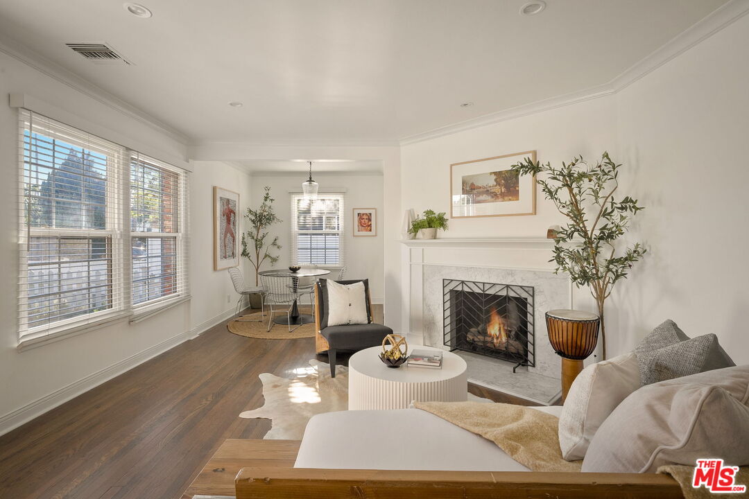 1209 Appleton Way Venice, CA 90291 - Photo 6 of 46 a living room with furniture a fireplace and a large window