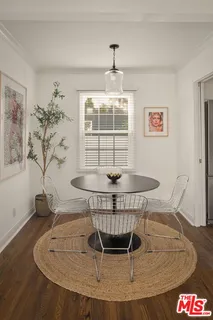 a dining room with a table and chairs
