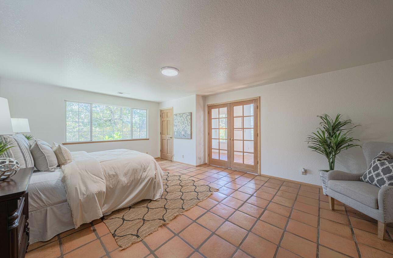 158 Echo Valley Road Prunedale, CA 93907 - Photo 40 of 70 a spacious bedroom with a large bed and a window