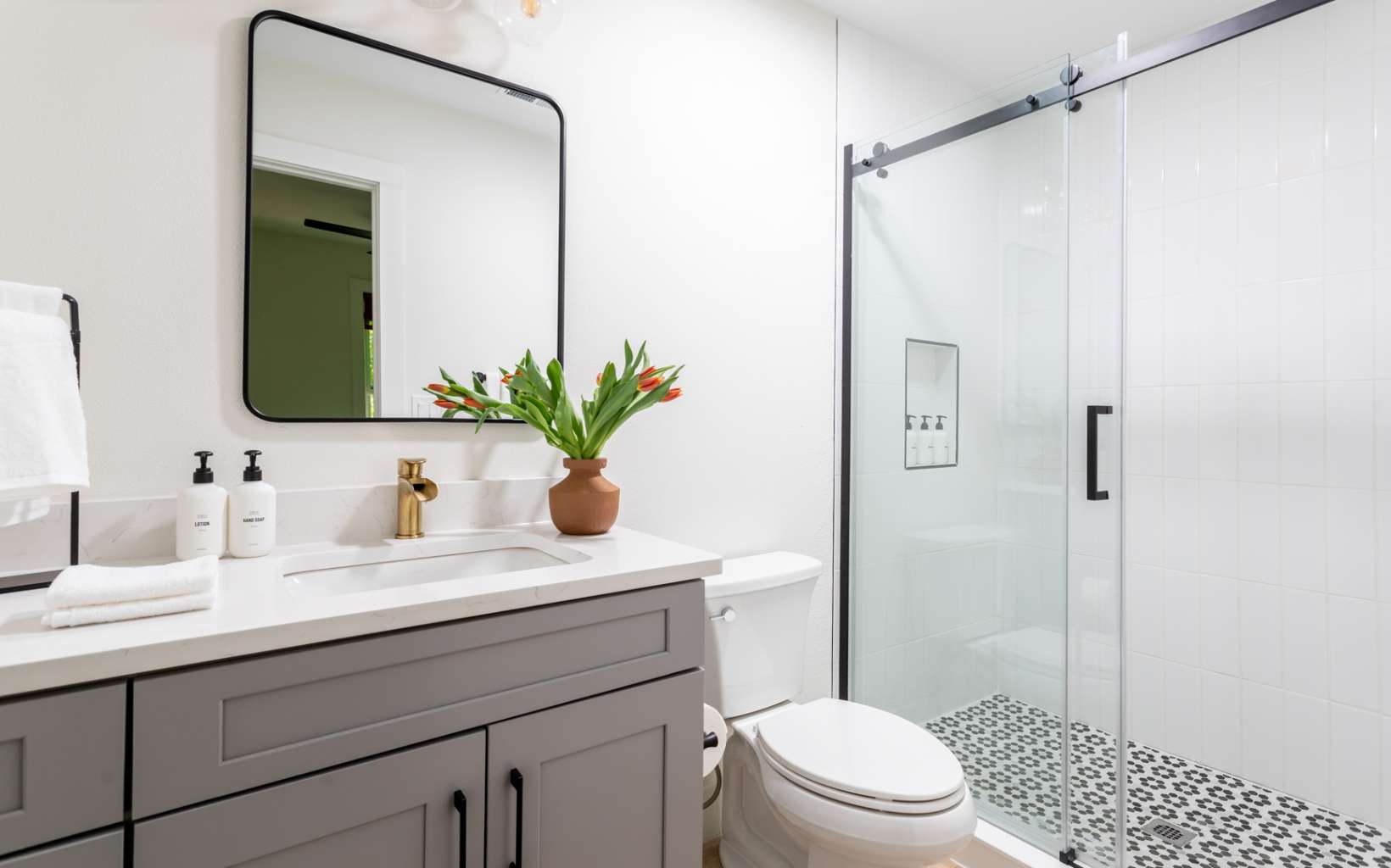 2000 Aska Road Blue Ridge, GA 30513 - Photo 14 of 22 a bathroom with a sink a toilet a shower and a mirror