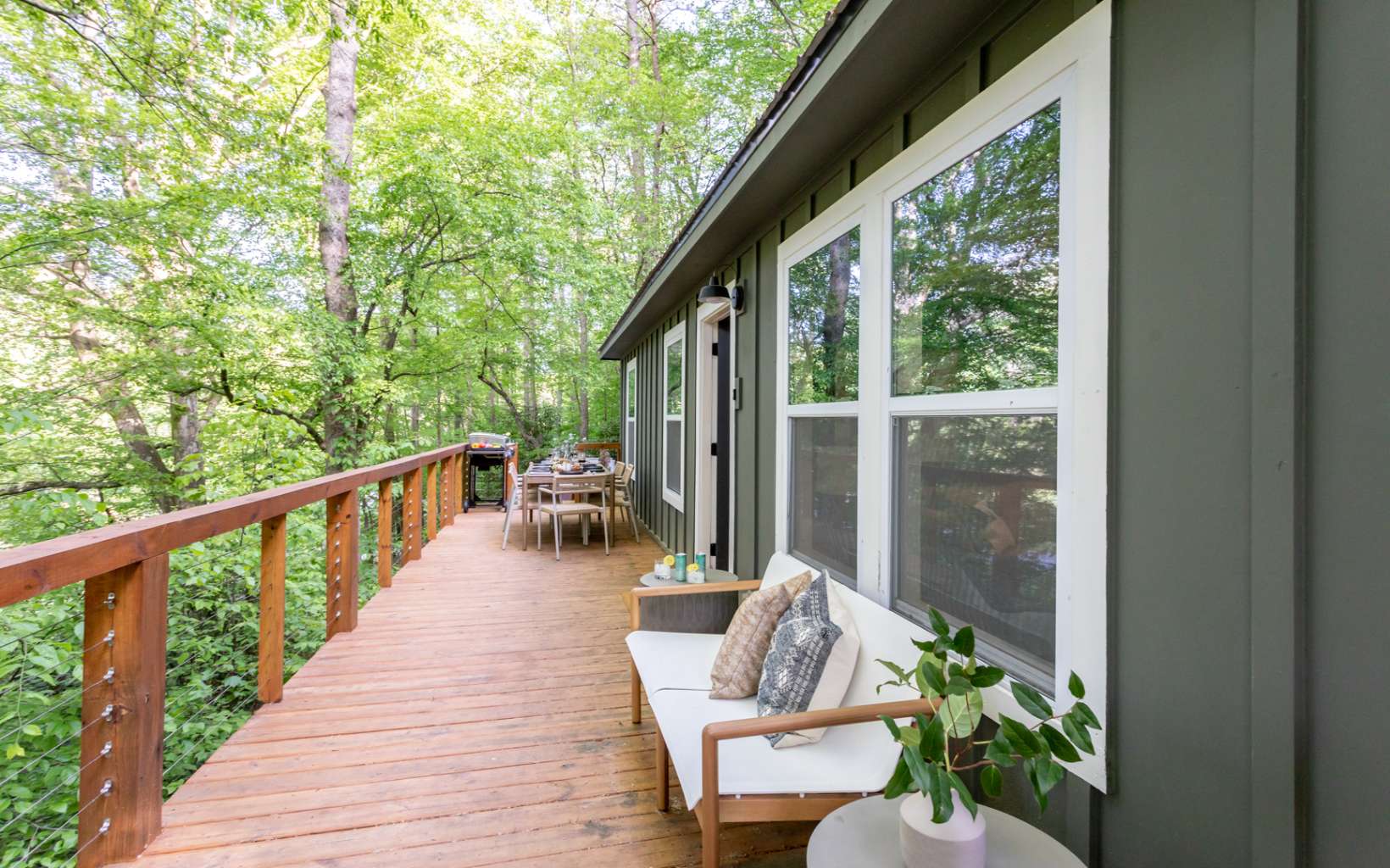 2000 Aska Road Blue Ridge, GA 30513 - Photo 20 of 22 a balcony with wooden floor and outdoor seating