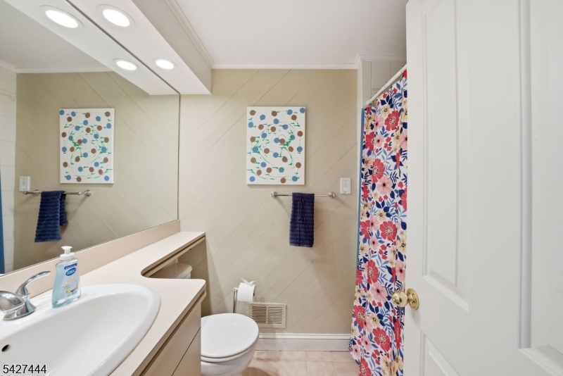 156 Kingsland Road Boonton, NJ 07005 - Photo 24 of 38 a bathroom with a sink toilet and shower curtain