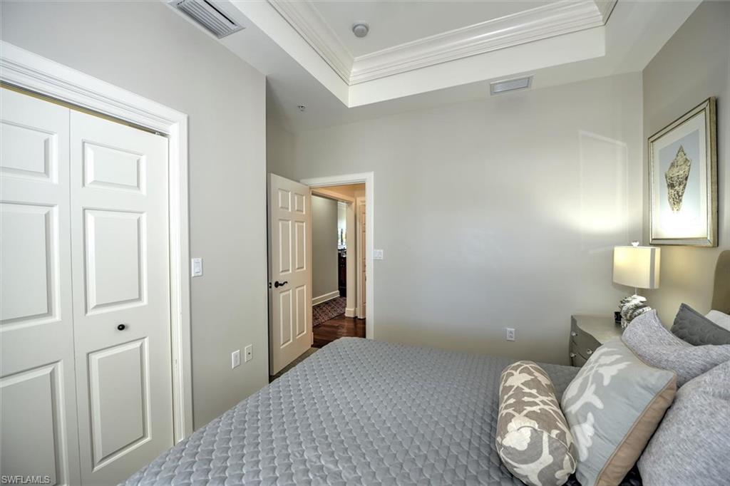555 5th Avenue South, Unit PH1 Naples, FL 34102 - Photo 21 of 31 a bedroom with a bed and a window