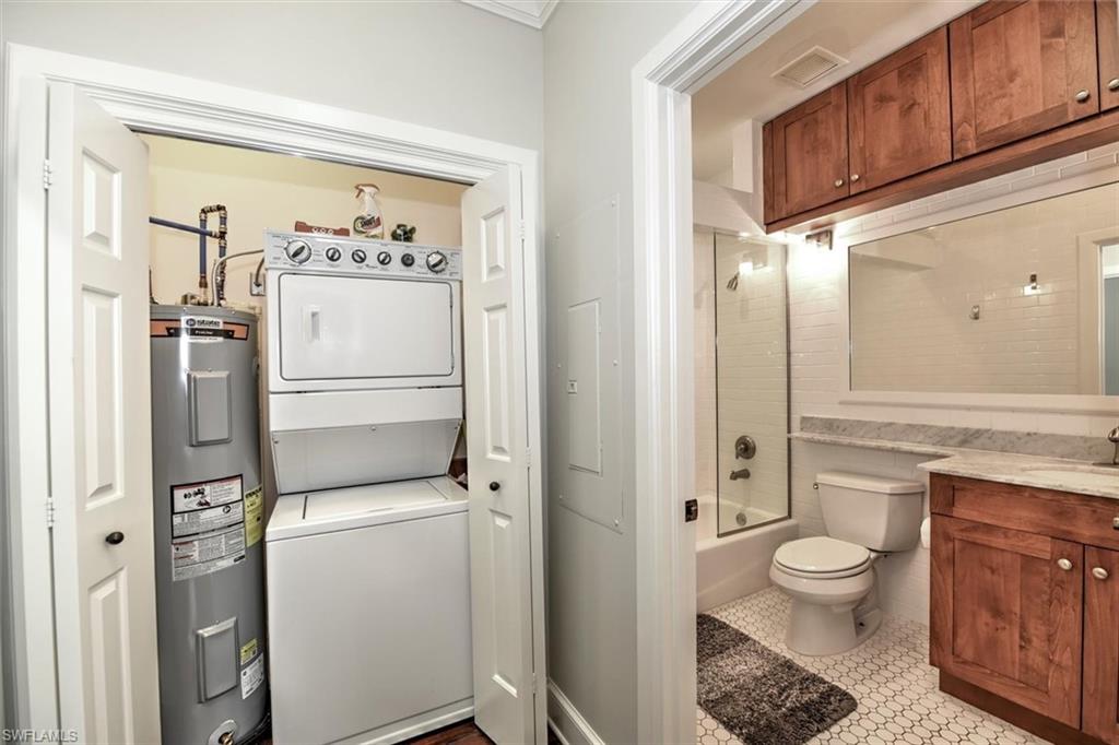 555 5th Avenue South, Unit PH1 Naples, FL 34102 - Photo 23 of 31 a bathroom with a toilet sink and shower