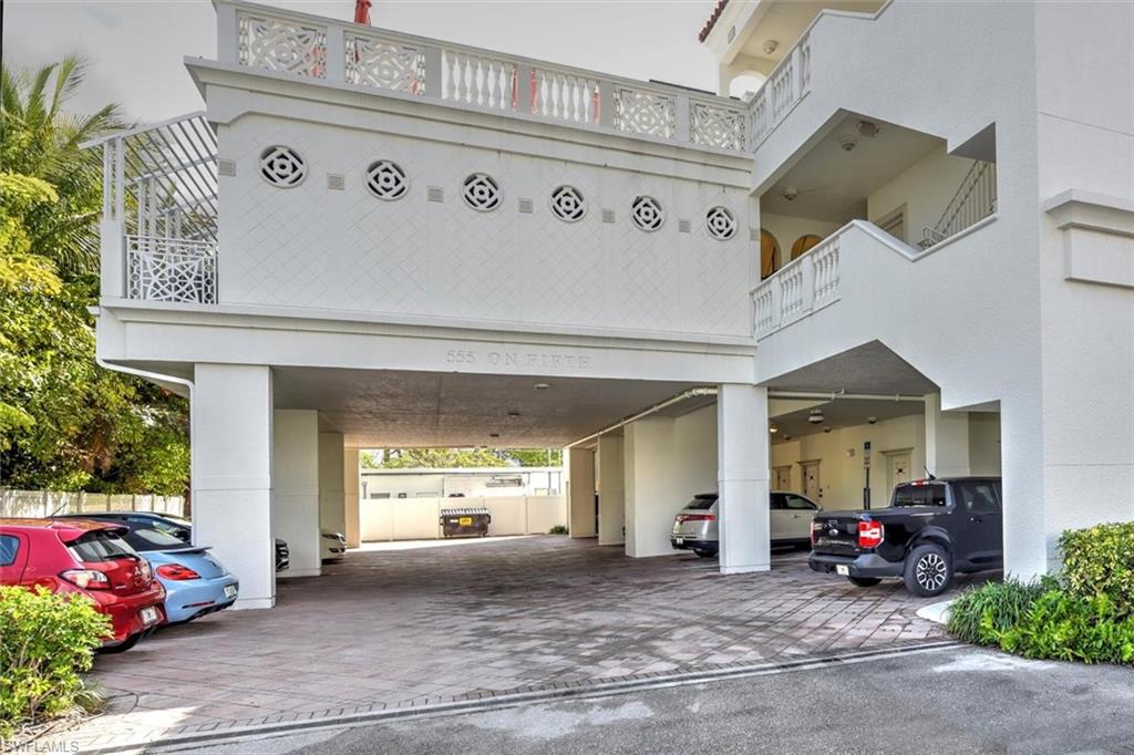 555 5th Avenue South, Unit PH1 Naples, FL 34102 - Photo 3 of 31 a view of a house with lots of potted plants