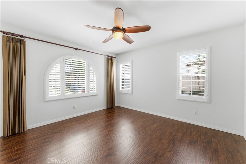 480 Santa Maria Street Anaheim, CA 92801 - Photo 3 of 17 a view of an empty room with wooden floor and a window