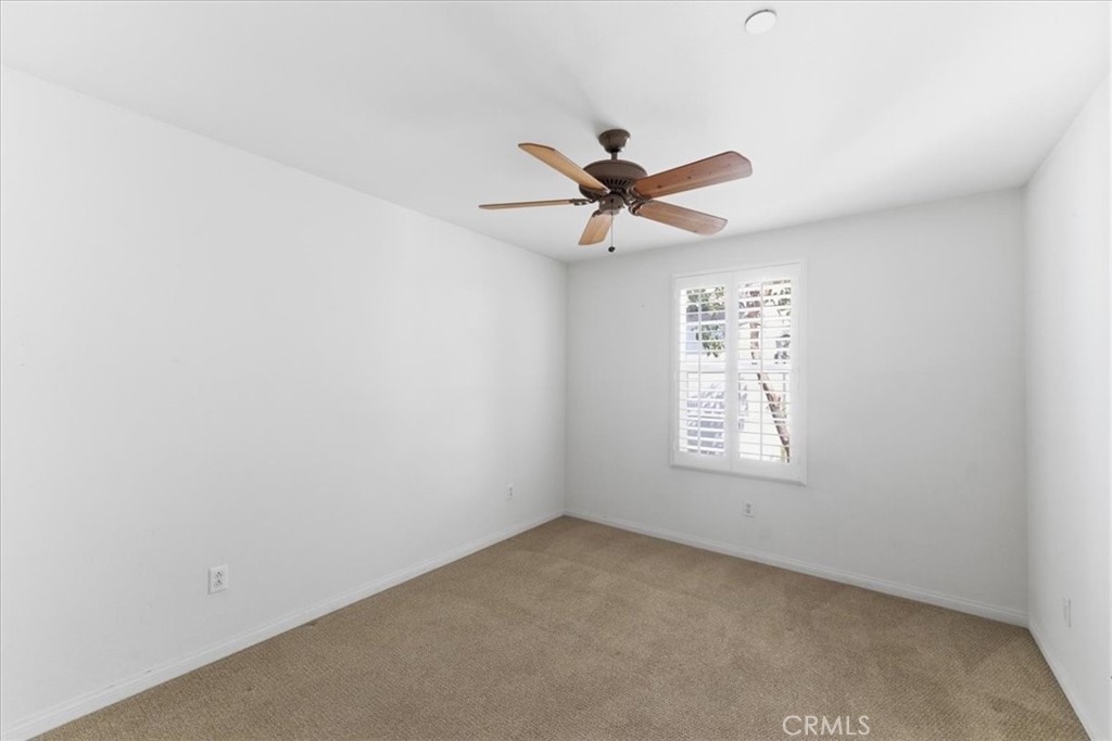 480 Santa Maria Street Anaheim, CA 92801 - Photo 6 of 17 an empty room with a window and a fan