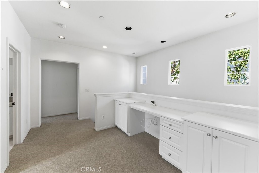 480 Santa Maria Street Anaheim, CA 92801 - Photo 10 of 17 a view of a kitchen with white cabinets and window