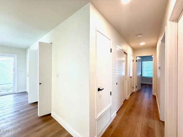 a bathroom with a bathtub shower sink vanity and toilet