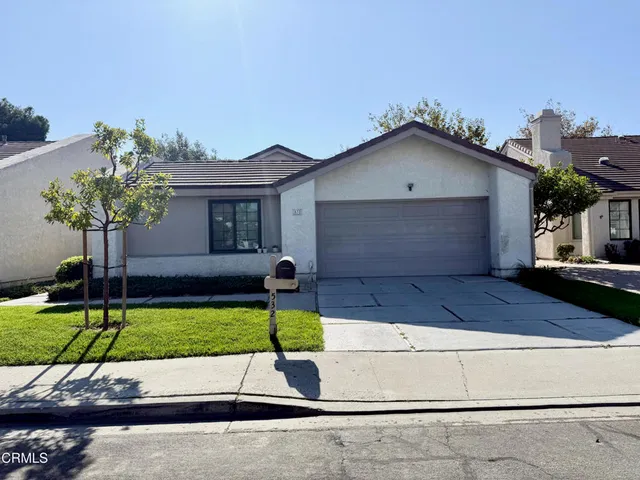 a view of outdoor space with signage and flags