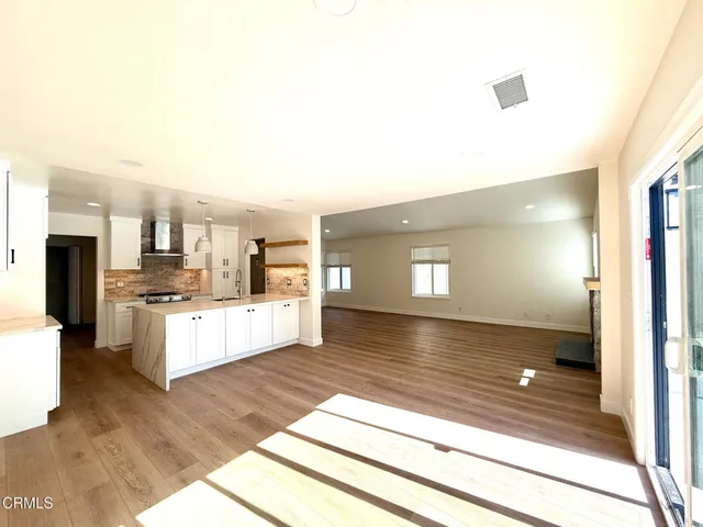 a large bathroom with a sink and a mirror