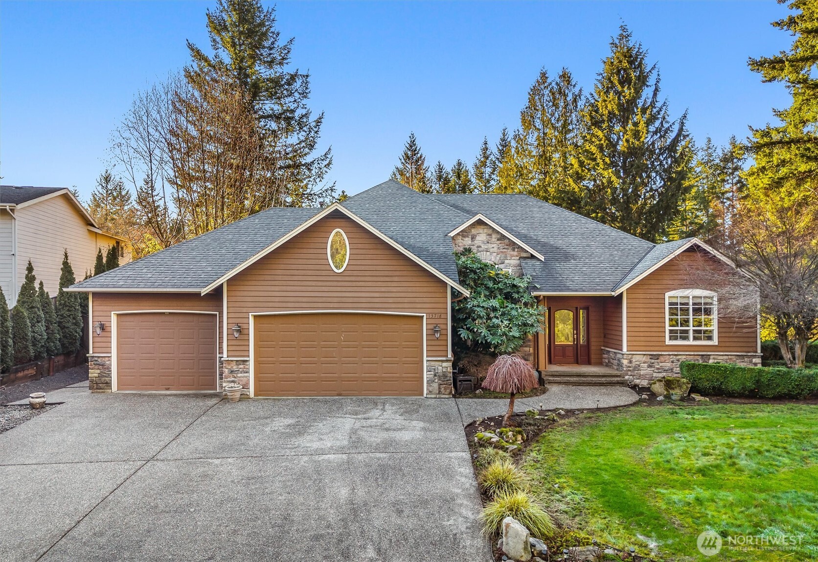13718 58th Street Southeast Snohomish, WA 98290 - Photo 1 of 40 a front view of house with yard and green space
