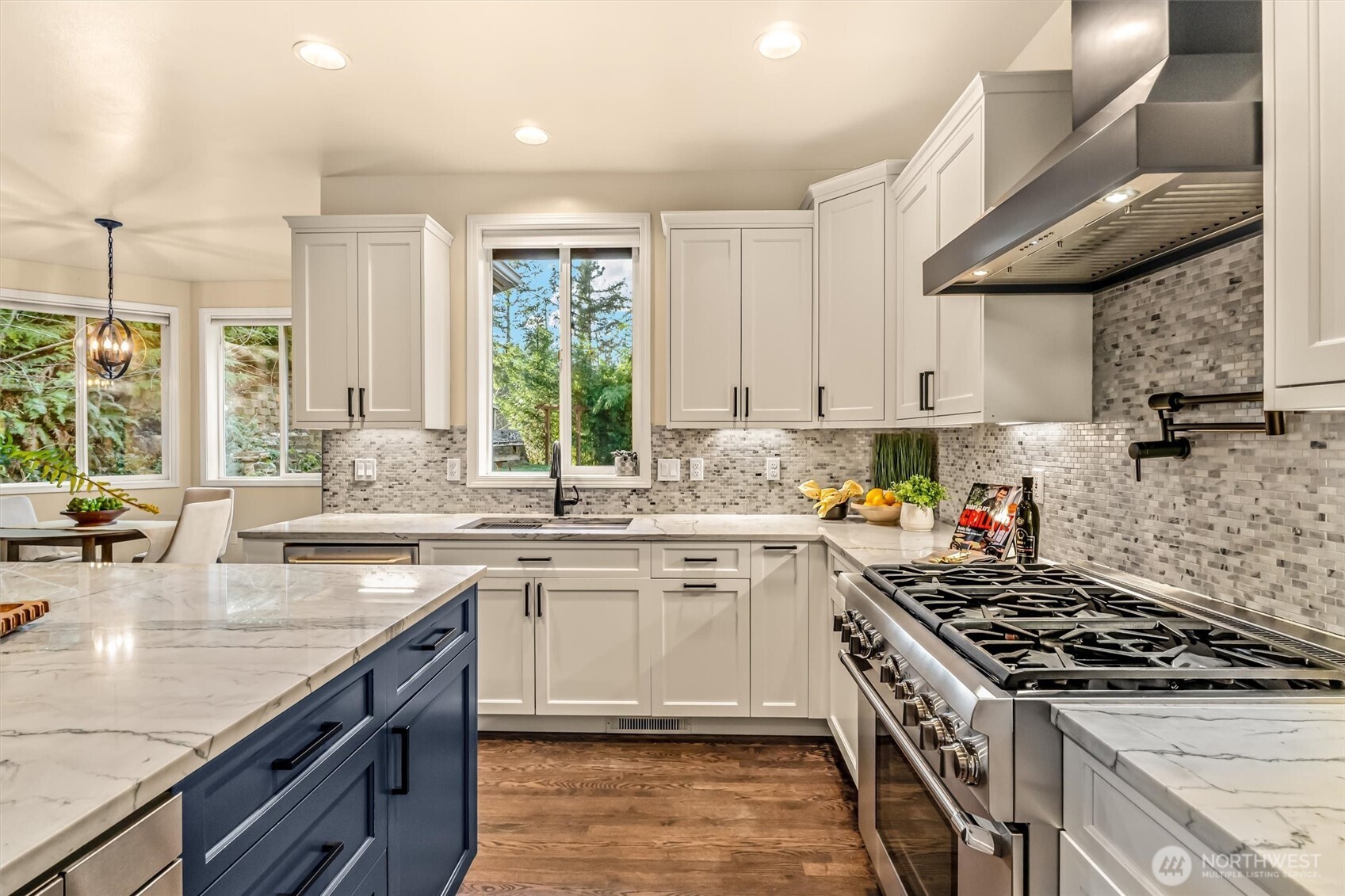 13718 58th Street Southeast Snohomish, WA 98290 - Photo 12 of 40 a kitchen with stainless steel appliances a sink a stove and cabinets