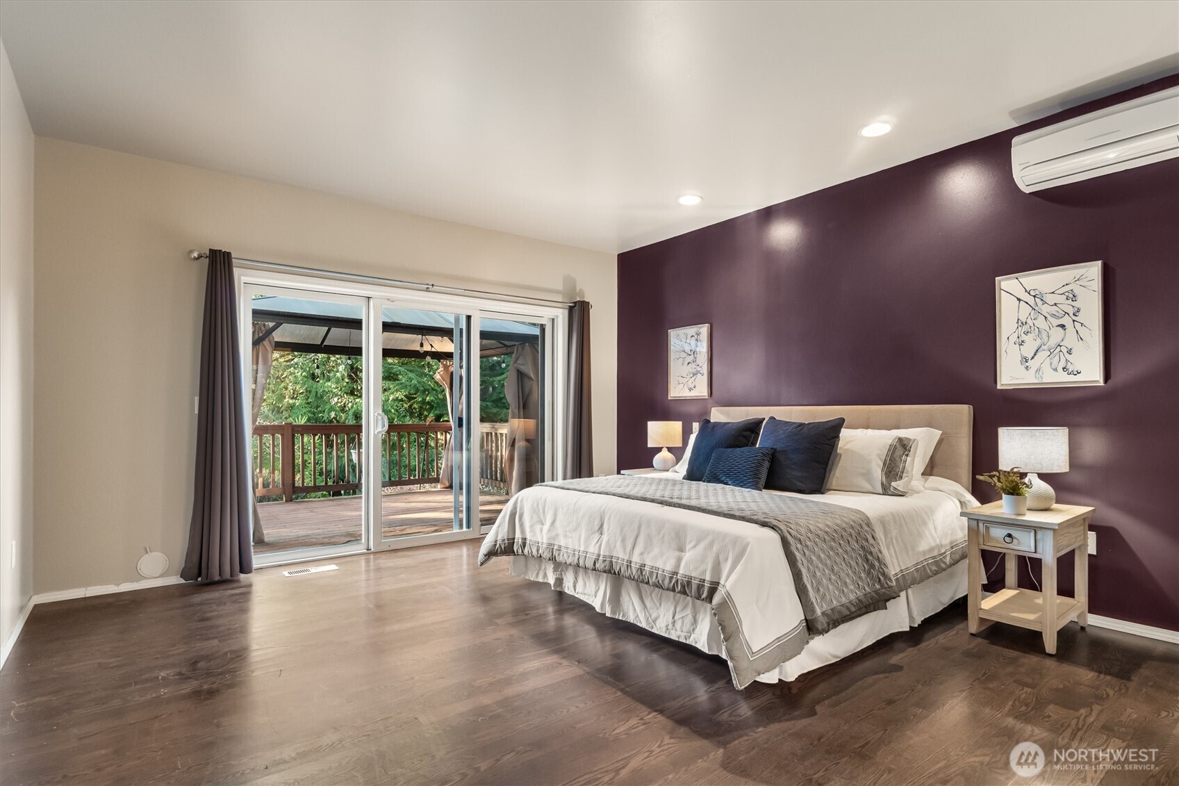 13718 58th Street Southeast Snohomish, WA 98290 - Photo 18 of 40 a large bedroom with a bed and wooden floor