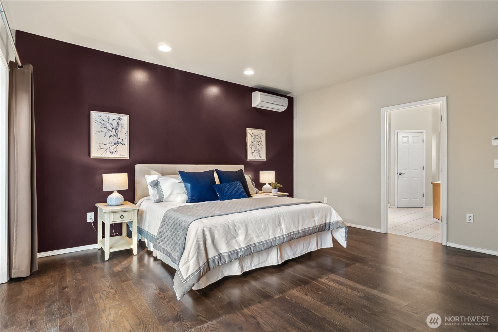 13718 58th Street Southeast Snohomish, WA 98290 - Photo 19 of 40 a large bedroom with a bed and a night stand