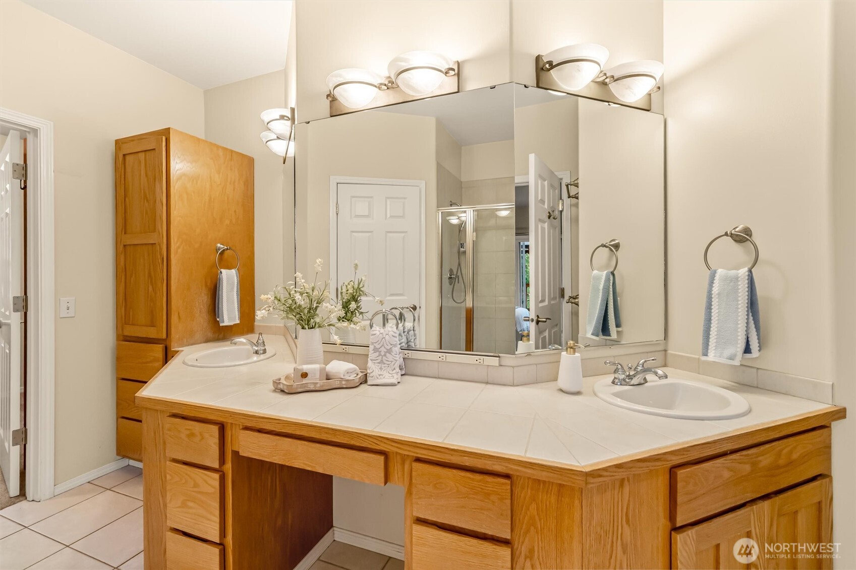 13718 58th Street Southeast Snohomish, WA 98290 - Photo 22 of 40 a bathroom with a sink and a mirror