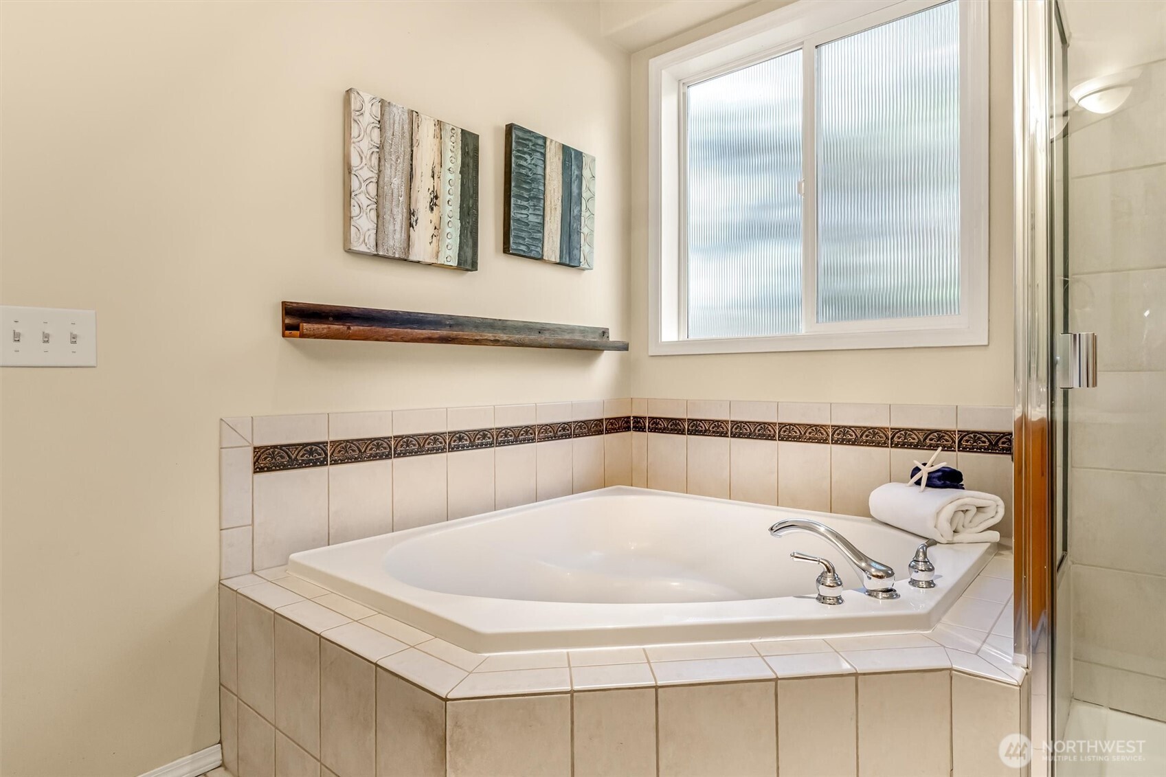 13718 58th Street Southeast Snohomish, WA 98290 - Photo 23 of 40 a white bath tub sitting next to a window