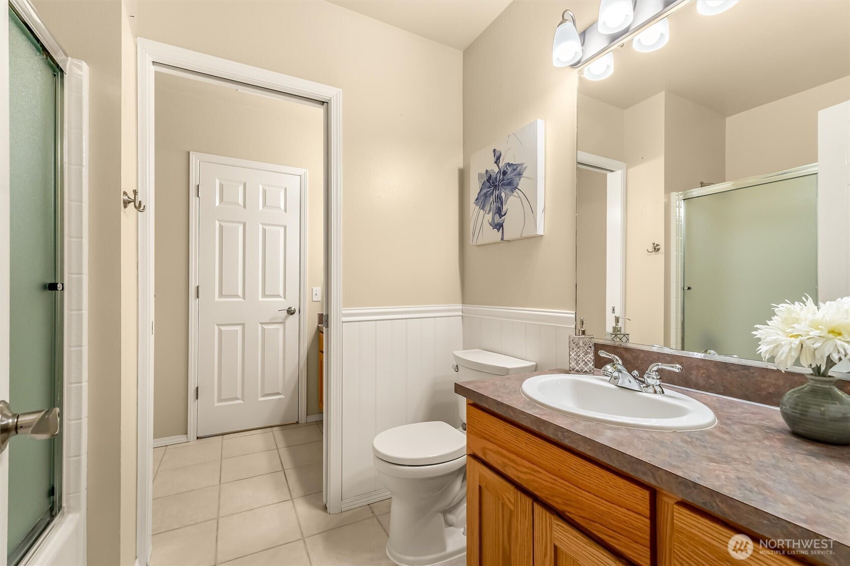 13718 58th Street Southeast Snohomish, WA 98290 - Photo 28 of 40 a bathroom with a granite countertop sink toilet and shower