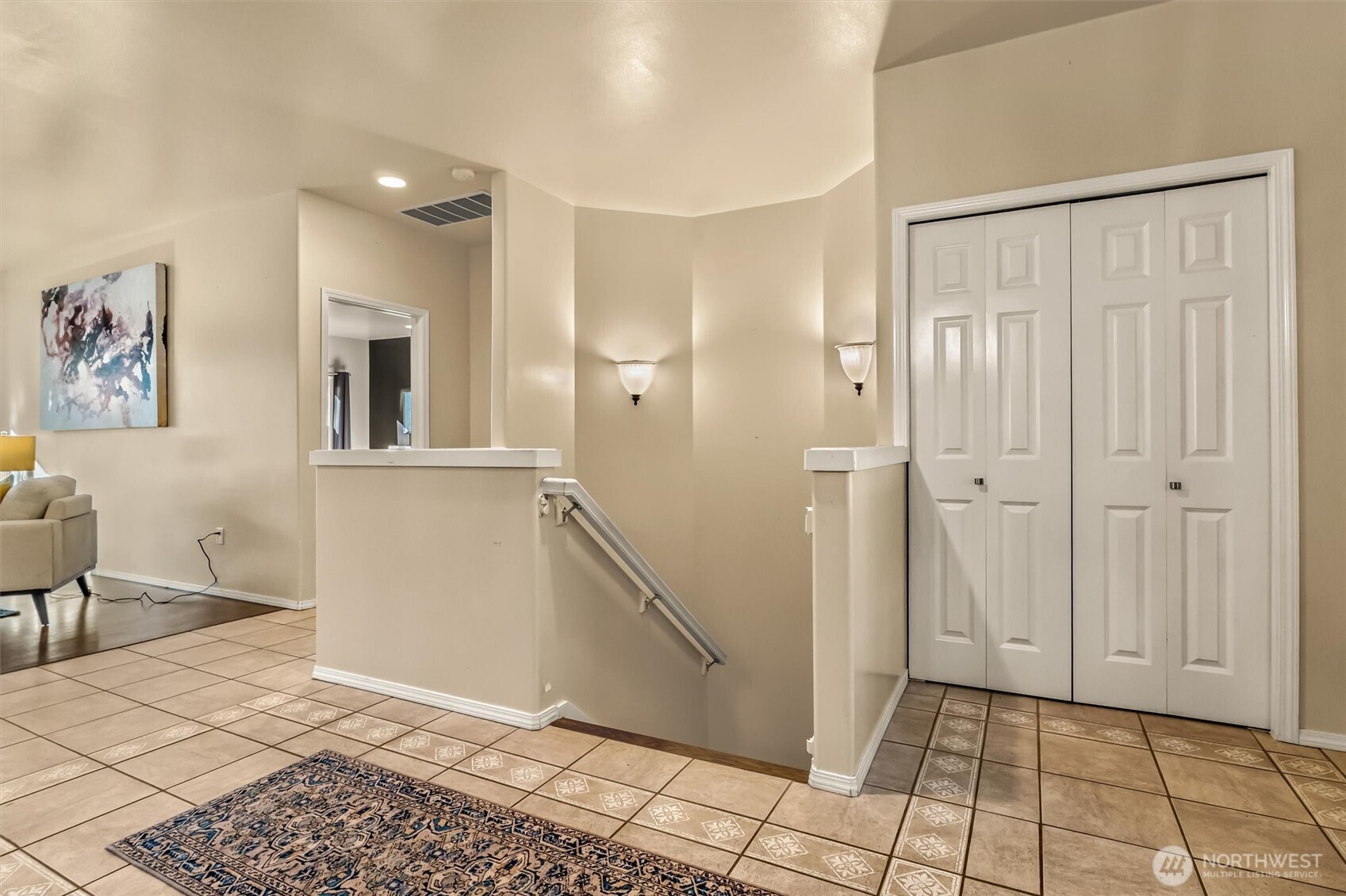 13718 58th Street Southeast Snohomish, WA 98290 - Photo 3 of 40 a view of a hallway with paintings on the wall