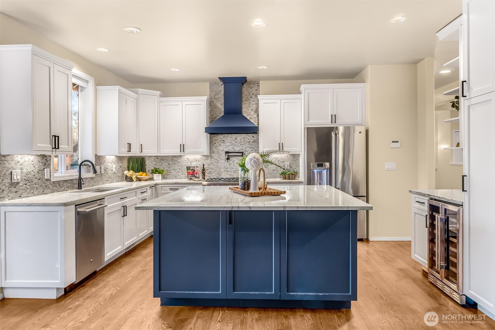 13718 58th Street Southeast Snohomish, WA 98290 - Photo 10 of 40 a kitchen with stainless steel appliances granite countertop a sink stove and refrigerator