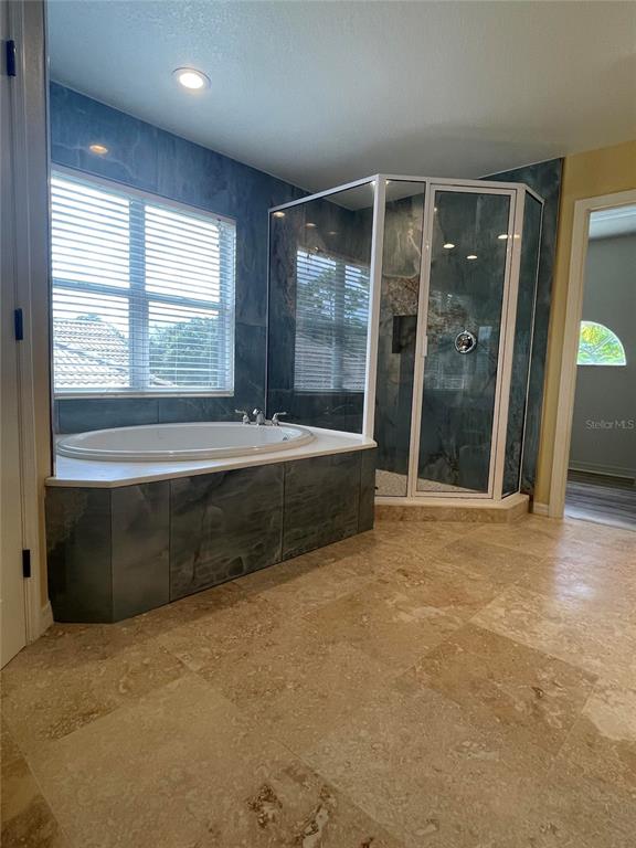 759 Fordingbridge Way Osprey, FL 34229 - Photo 13 of 51 a spacious bedroom with a large bed and a large window