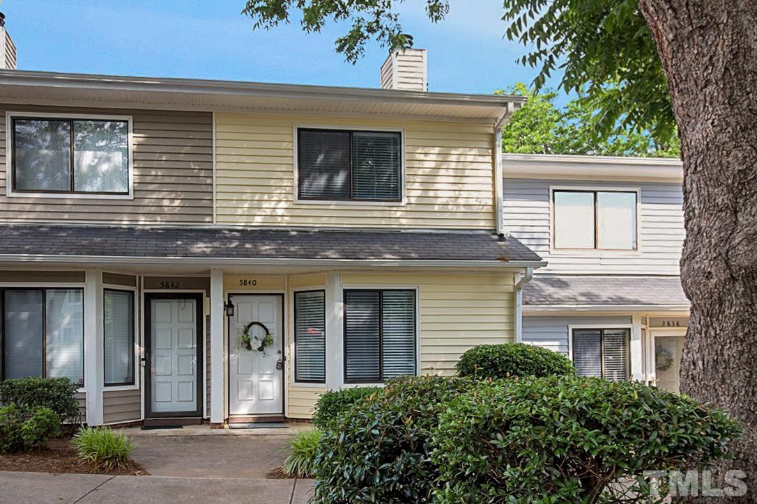 5840 Shady Grove Circle Raleigh, NC 27609 - Photo 1 of 18 front view of a brick house with a large windows