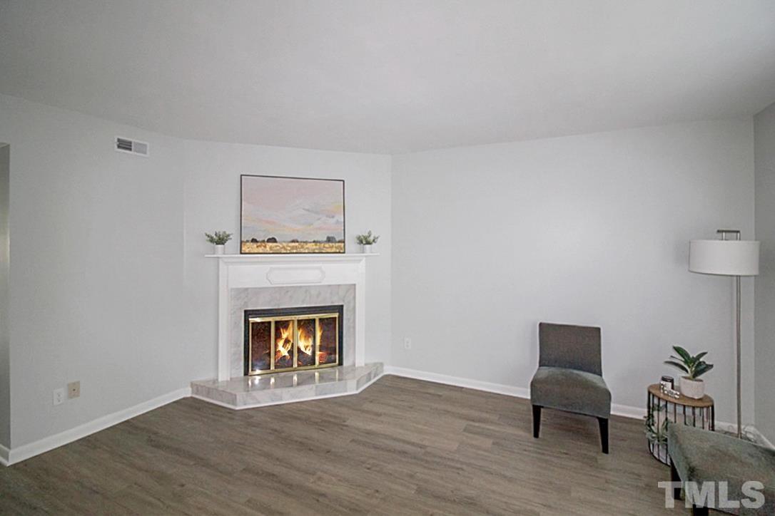 5840 Shady Grove Circle Raleigh, NC 27609 - Photo 2 of 18 a living room with furniture and a fireplace