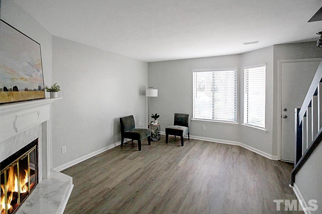 5840 Shady Grove Circle Raleigh, NC 27609 - Photo 3 of 18 a view of a livingroom with furniture and a fireplace