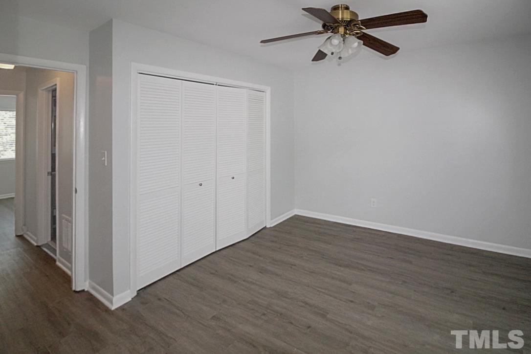 5840 Shady Grove Circle Raleigh, NC 27609 - Photo 9 of 18 a view of an empty room with wooden floor