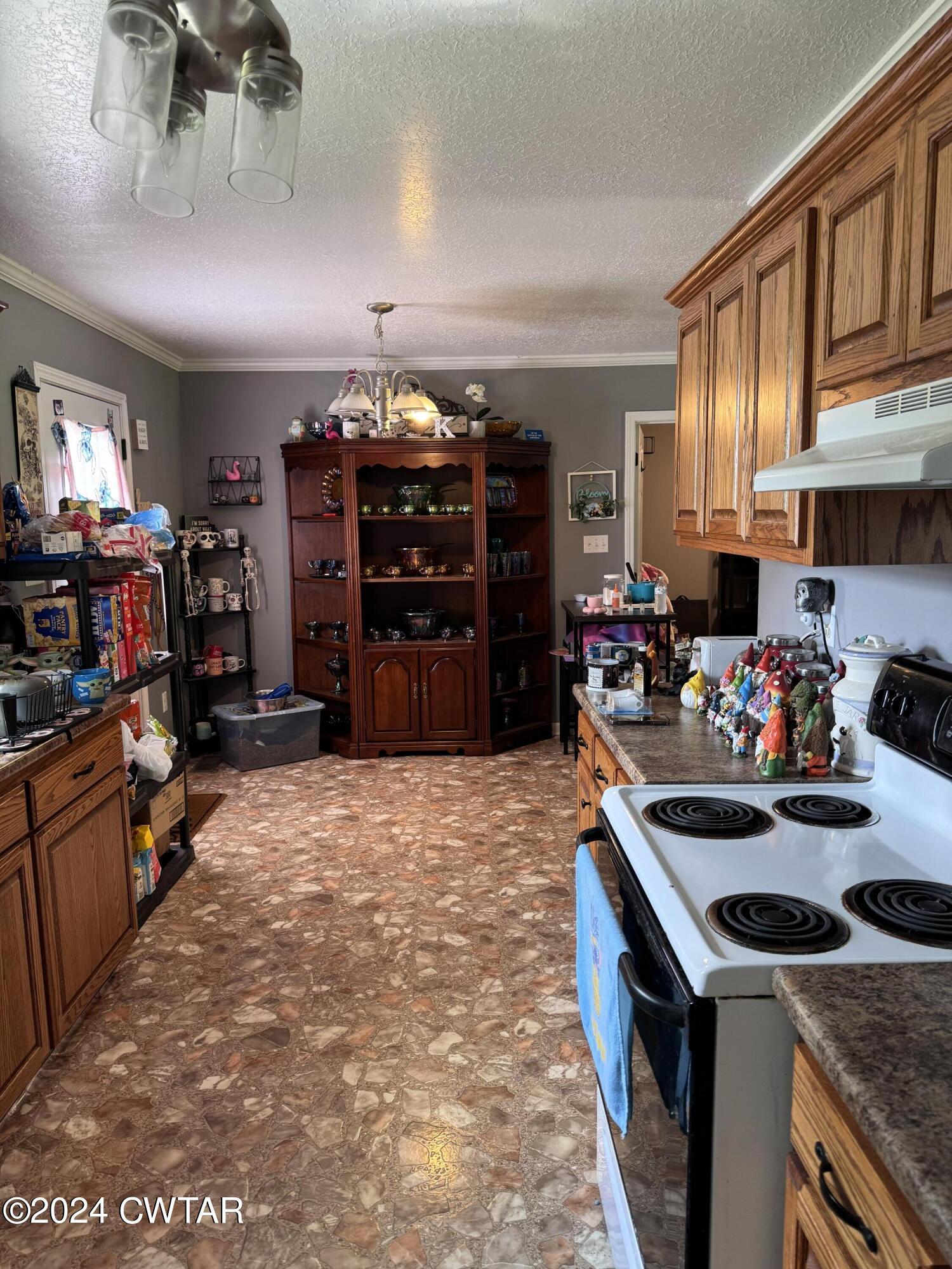19 Ora Goad Road Dyer, TN 38330 - Photo 11 of 12 a kitchen with a stove and a refrigerator