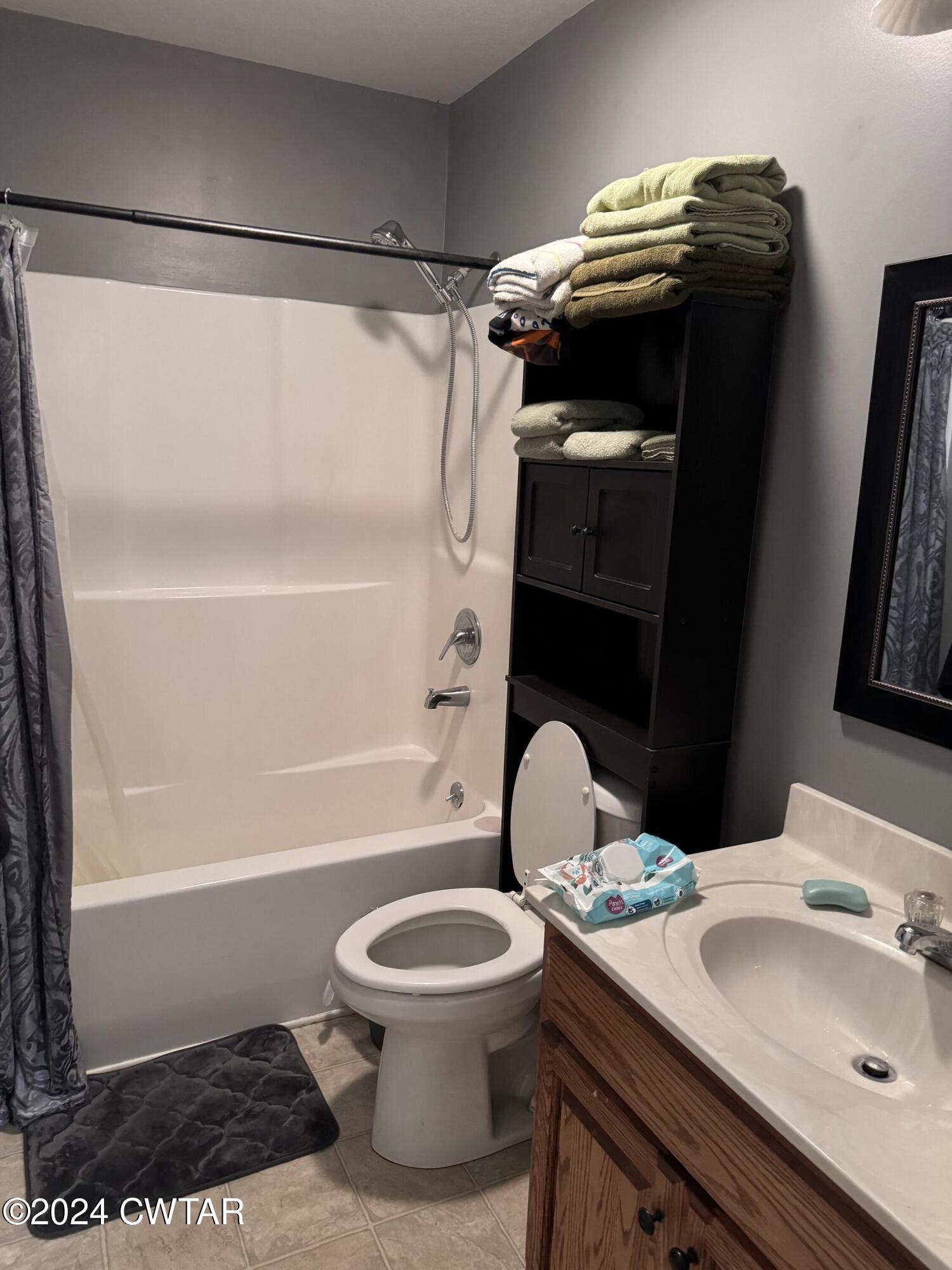 19 Ora Goad Road Dyer, TN 38330 - Photo 7 of 12 a bathroom with a sink a toilet and shower
