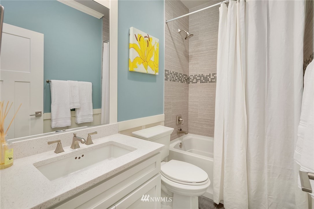 18607 45th Avenue Southeast Bothell, WA 98012 - Photo 11 of 23 a bathroom with a sink and a mirror
