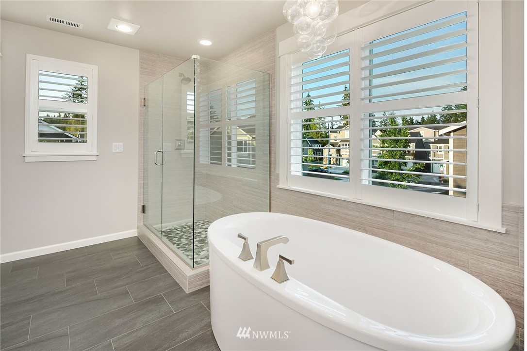 18607 45th Avenue Southeast Bothell, WA 98012 - Photo 15 of 23 a bathroom with a bathtub and window