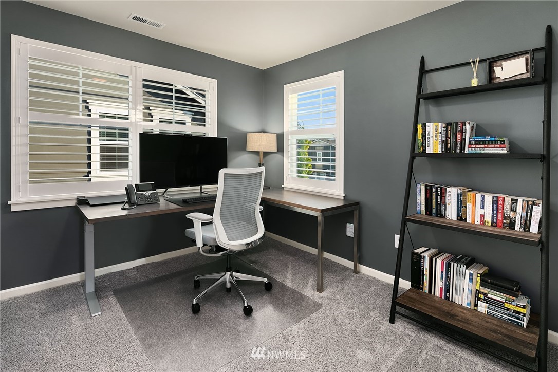 18607 45th Avenue Southeast Bothell, WA 98012 - Photo 16 of 23 a view of a workspace with furniture and a window