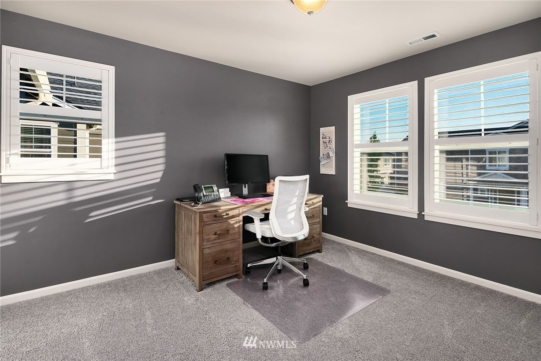 18607 45th Avenue Southeast Bothell, WA 98012 - Photo 17 of 23 a view of a workspace with furniture and a window