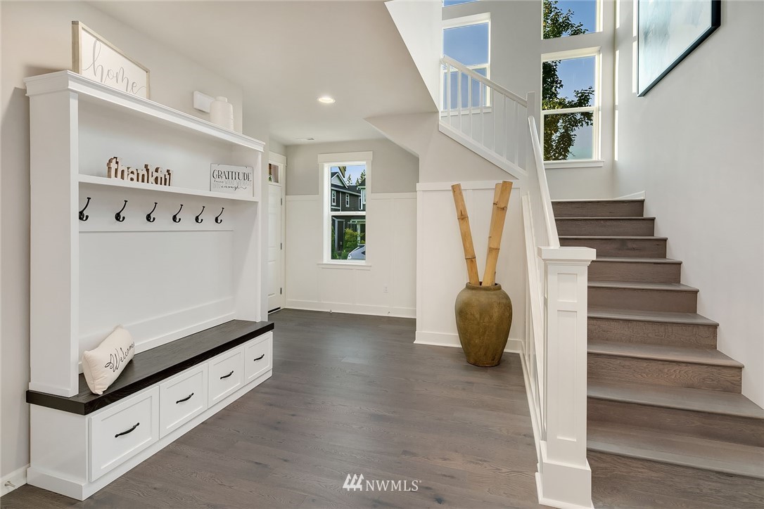 18607 45th Avenue Southeast Bothell, WA 98012 - Photo 9 of 23 a hallway with stairs and toys