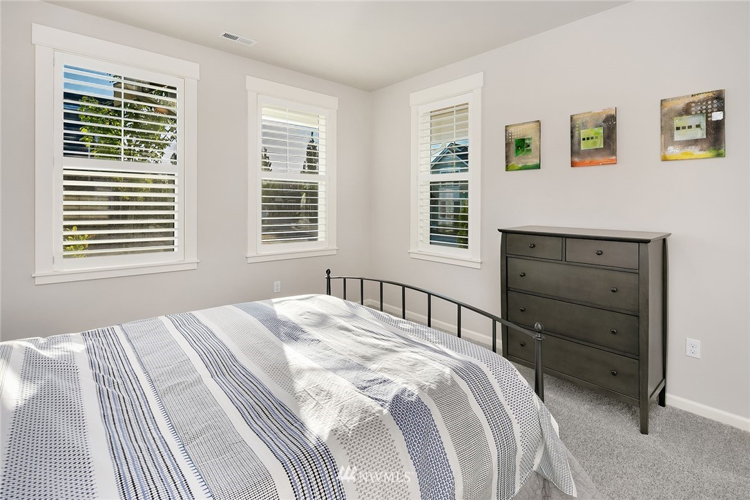 18607 45th Avenue Southeast Bothell, WA 98012 - Photo 10 of 23 a bedroom with a bed and a window