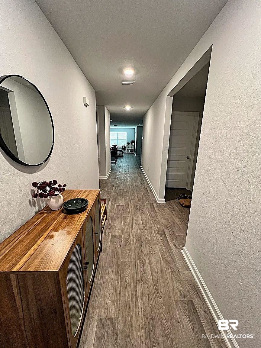 23915 Veranda Circle Elberta, AL 36530 - Photo 2 of 16 Hall with wood finished floors and a textured wall