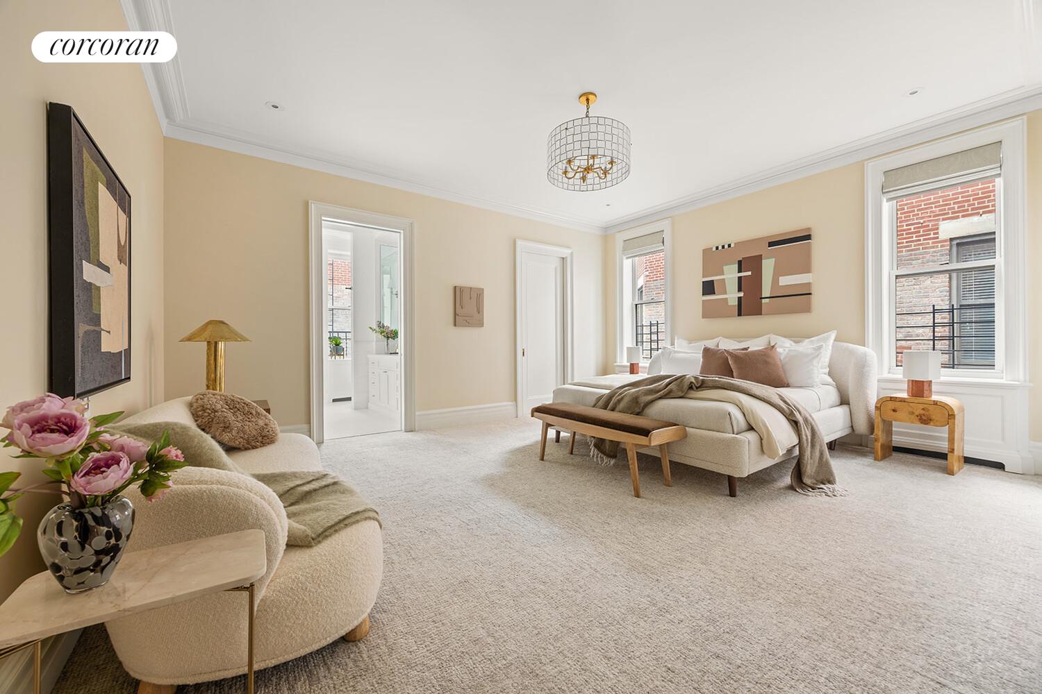 16 East 96th Street, Unit 7B Manhattan, NY 10128 - Photo 15 of 55 a bedroom with bed and a chandelier
